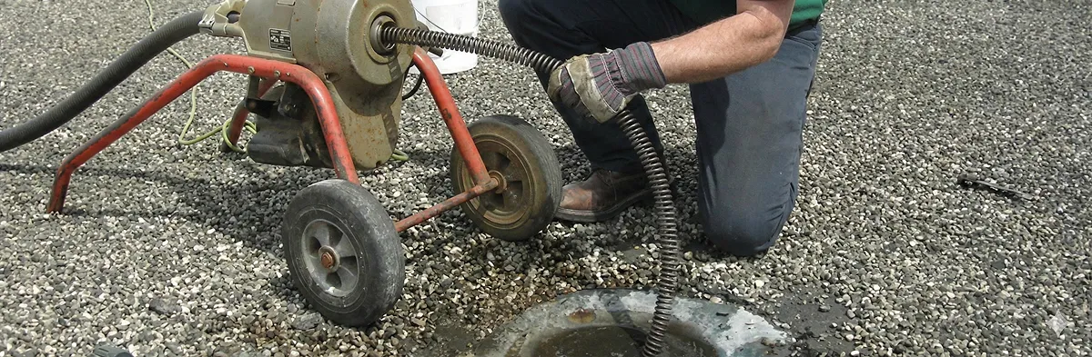 sewer rodding technician actively removing blockages from a sewer line in Clearwater, FL